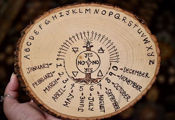 Handmade pendulum board with a crystal pendulum